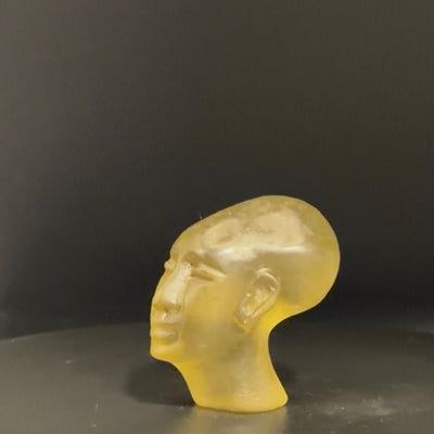 Akhenaten head sculpture in Libyan desert glass
