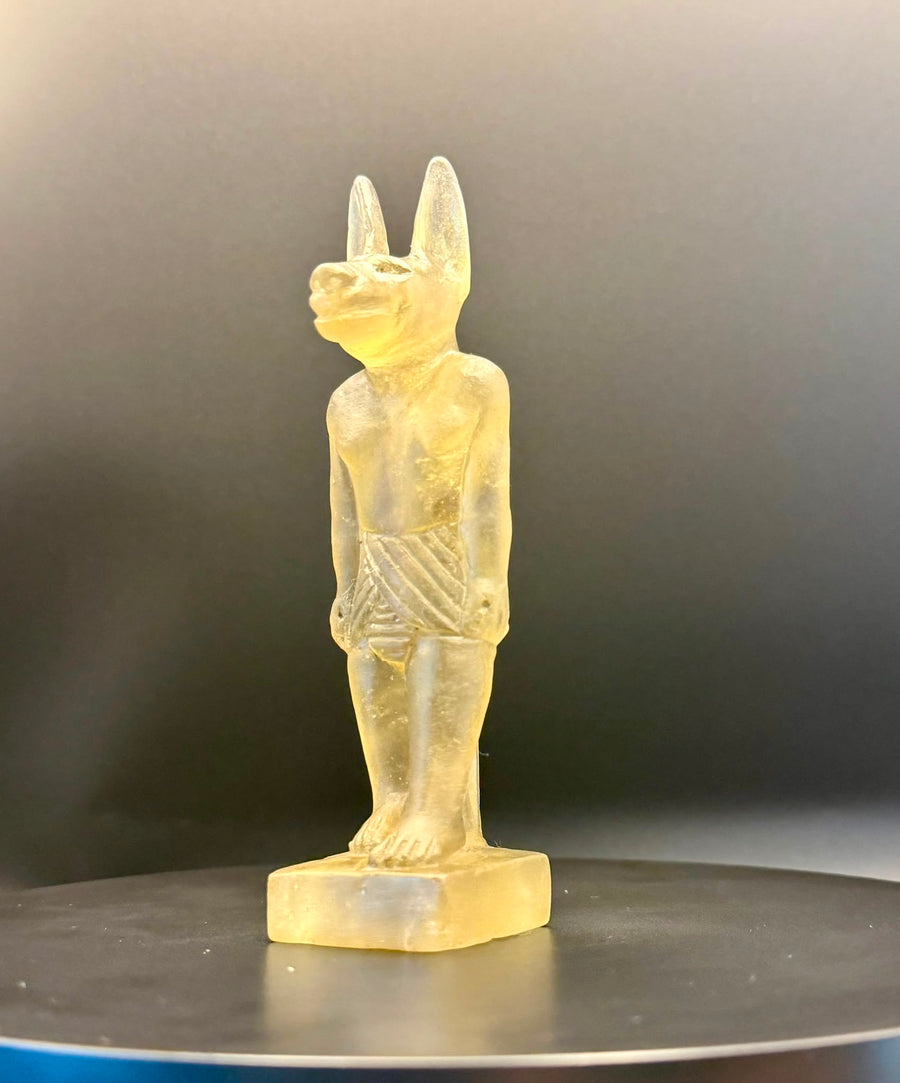 Anubis pendant carved in pale green Libyan desert glass